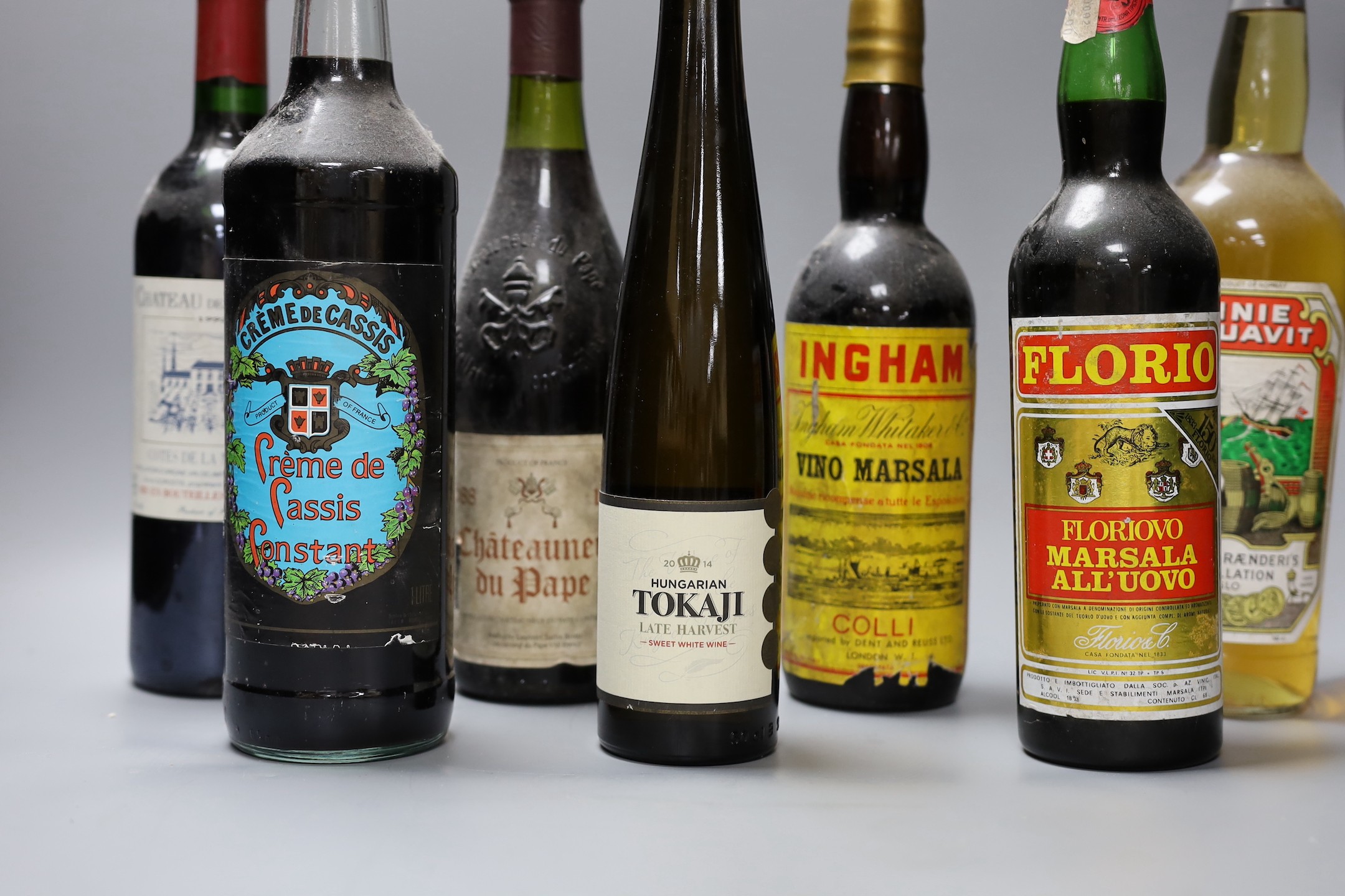 A selection of nine bottles of alcohol, to include Châteauneuf du Pape, Linie Aquavit, and others